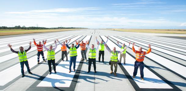 The new runway landed under budget at $1.1 billion